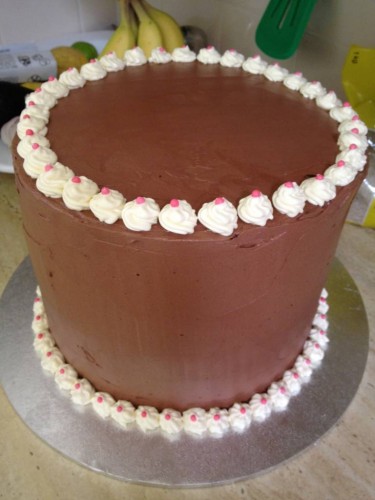 Neapolitan cake with chocolate butter cream icing 