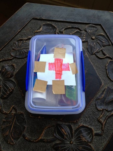 Alfie's hand-made first aid kit.  It even has a red cross!  