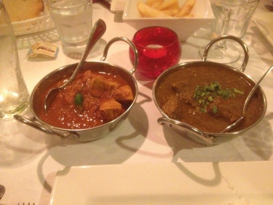 The two curries with Alfie's chips in the background