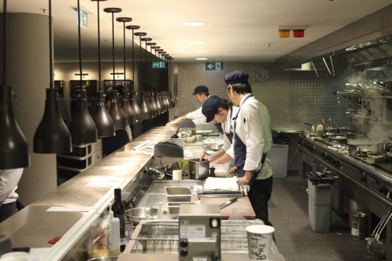 Chefs working in a fish bowl