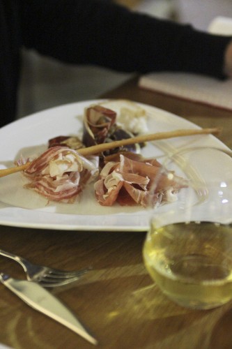Primo.  A selection of cured meats with white wine