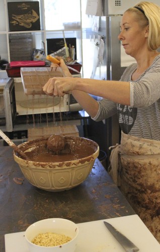 Rebecca making hollow molds for salted caramel chocolates