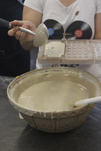 Pouring the spiced white chocolate into the molds