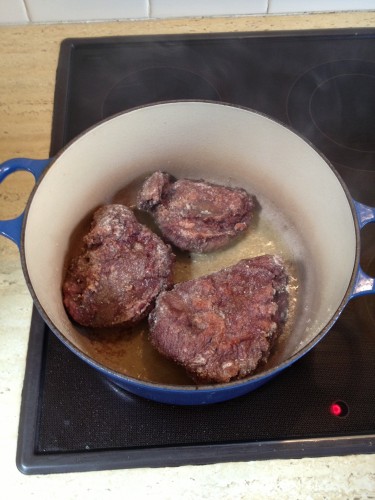 Brown the meat in heated olive oil 