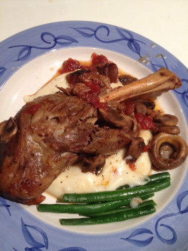 Slow-cooked lamb shanks with potato mash and steamed green beans
