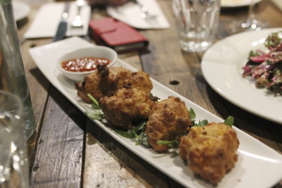 Sweet born fritters with seven-day hot sauce $10