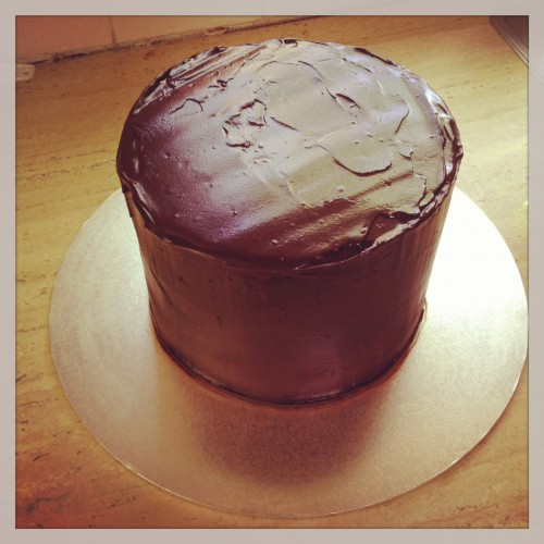 The cake covered in ganache
