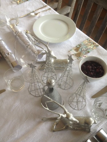 A table dressed for a Christmas Eve dinner