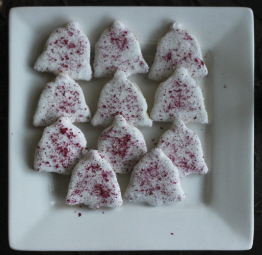 Christmas Bells.  Covered in white icing then sprinkled with edible red glitter 