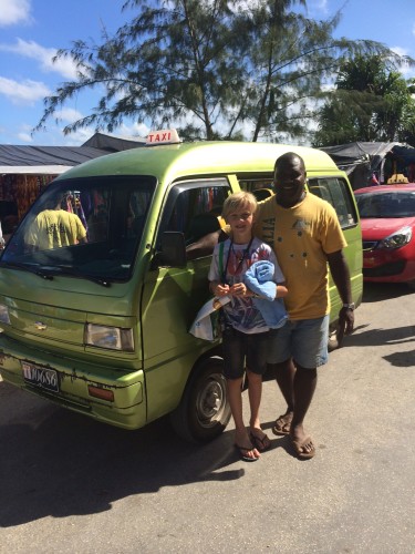Our taxi driver and tour guide, Willie, with his green and gold Australian T-shirt and his under-powered van with no air-conditioning.  