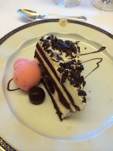 Black Forest Cake with sweetened cream and a scoop of sorbet