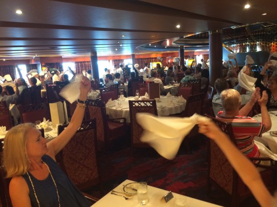 Waving our napkins in the air to salute those who had served us over the two weeks.