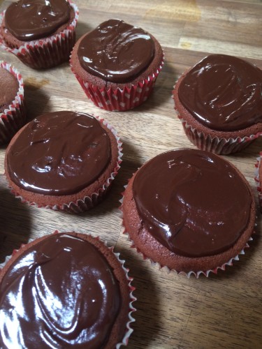 Chocolate cupcakes covered in ganache