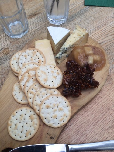 Cheese platter with fig paste and apple sauce