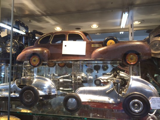 A toy pull-along car made in the Depression