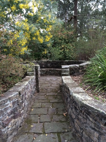 Sandstone paths and walls lead to peaceful places to sit
