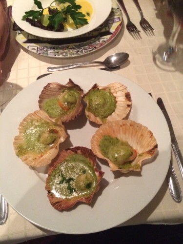 Tasmanian scallops, baked in their shells with a garlic and chive sauce