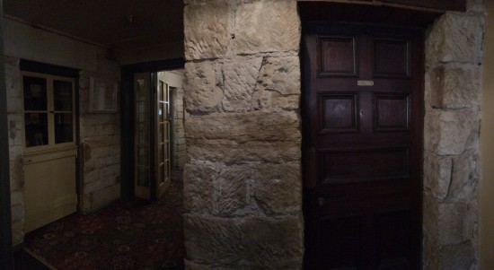 The sandstone walls inside the Inn