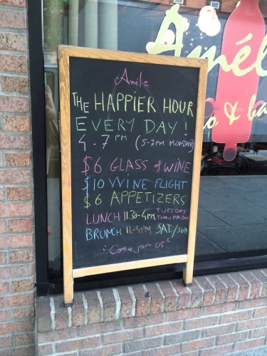 A blackboard advertising the Happy Hours 