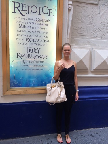 Arabella beside one of the posters outside the Theatre