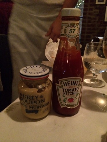 Condiments brought to the table for the burger