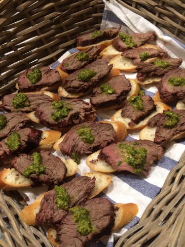 Eye fillets served in baskets with chimmichurri sauce