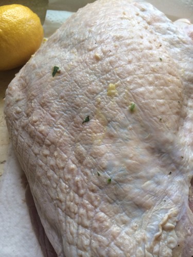 The herb butter has been rubbed under the skin