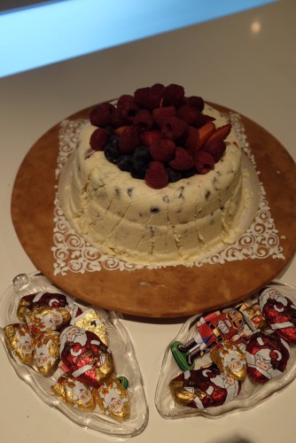 White Chocolate Bombe with berries and chocolates 