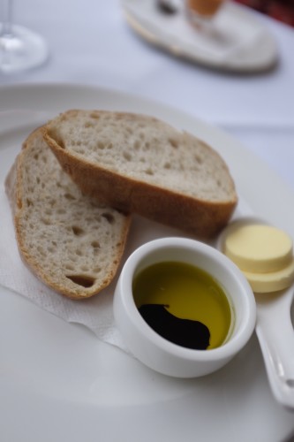 Warm bread with olive oil and balsamic or unsalted butter