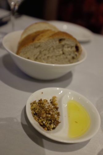 Complimentary warmed bread with olive oil and dukkah